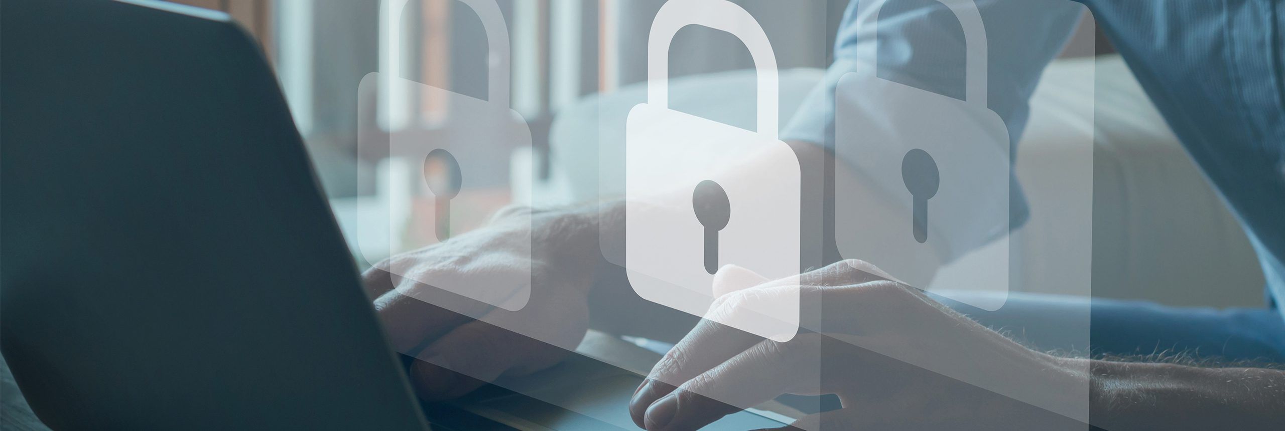 person typing on keyboard with security symbol graphic